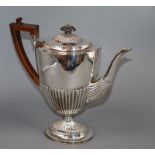 A late Victorian demi-fluted silver oval coffee pot, Charles Stuart Harris, London, 1896, gross 28