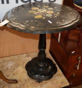 A Victorian oval papier mache tilt top table W.64cm