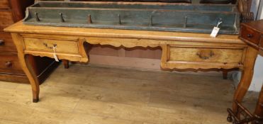 A French fruitwood writing table W.188cm