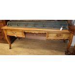 A French fruitwood writing table W.188cm