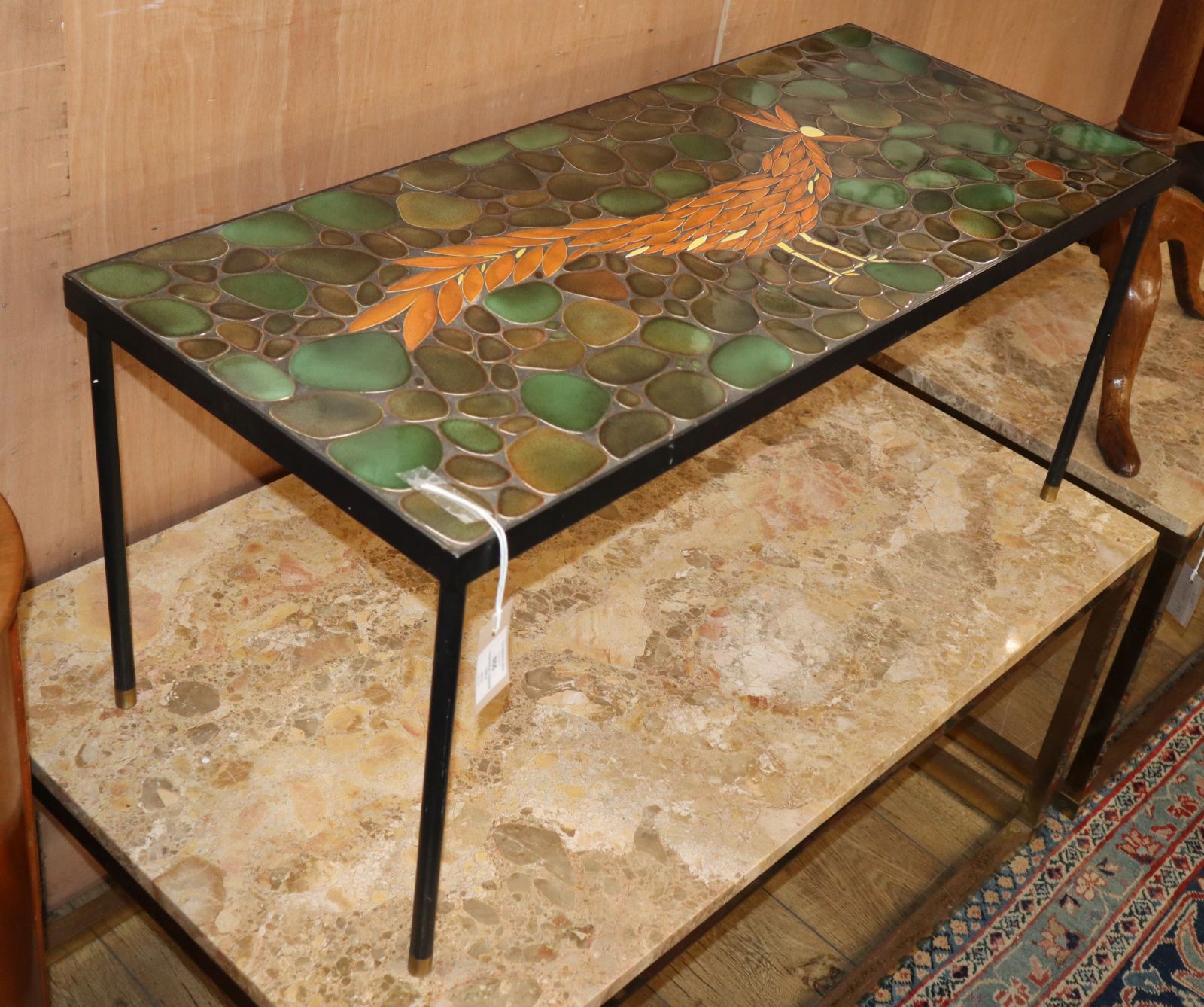 A 1960's enamelled metal "Peacock" coffee table W.91cm