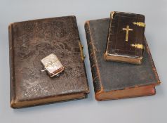 A Victorian photograph album and three bibles, one silver mounted