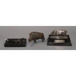 A 1935 Delhi Horse Show trophy modelled as a boar mounted on a plinth, a bronze model of a boar