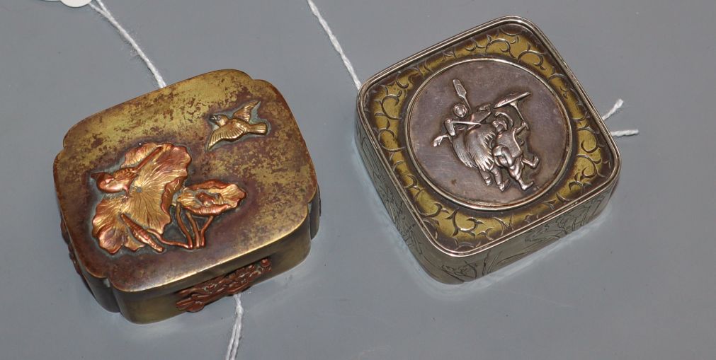 Two small Japanese decorative metal boxes with hinged covers, one of shaped square form in