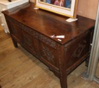 An 18th century oak coffer W.143cm