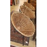 After Terence Conran, three wicker and iron tub chairs