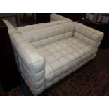 A pair of Josef Hoffmann Kubus ivory leather sofas W.150cm