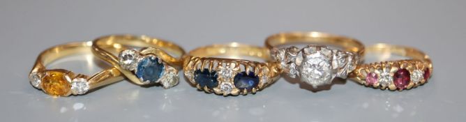 Five assorted 18ct and gem set rings, including a late Victorian ruby and diamond ring.