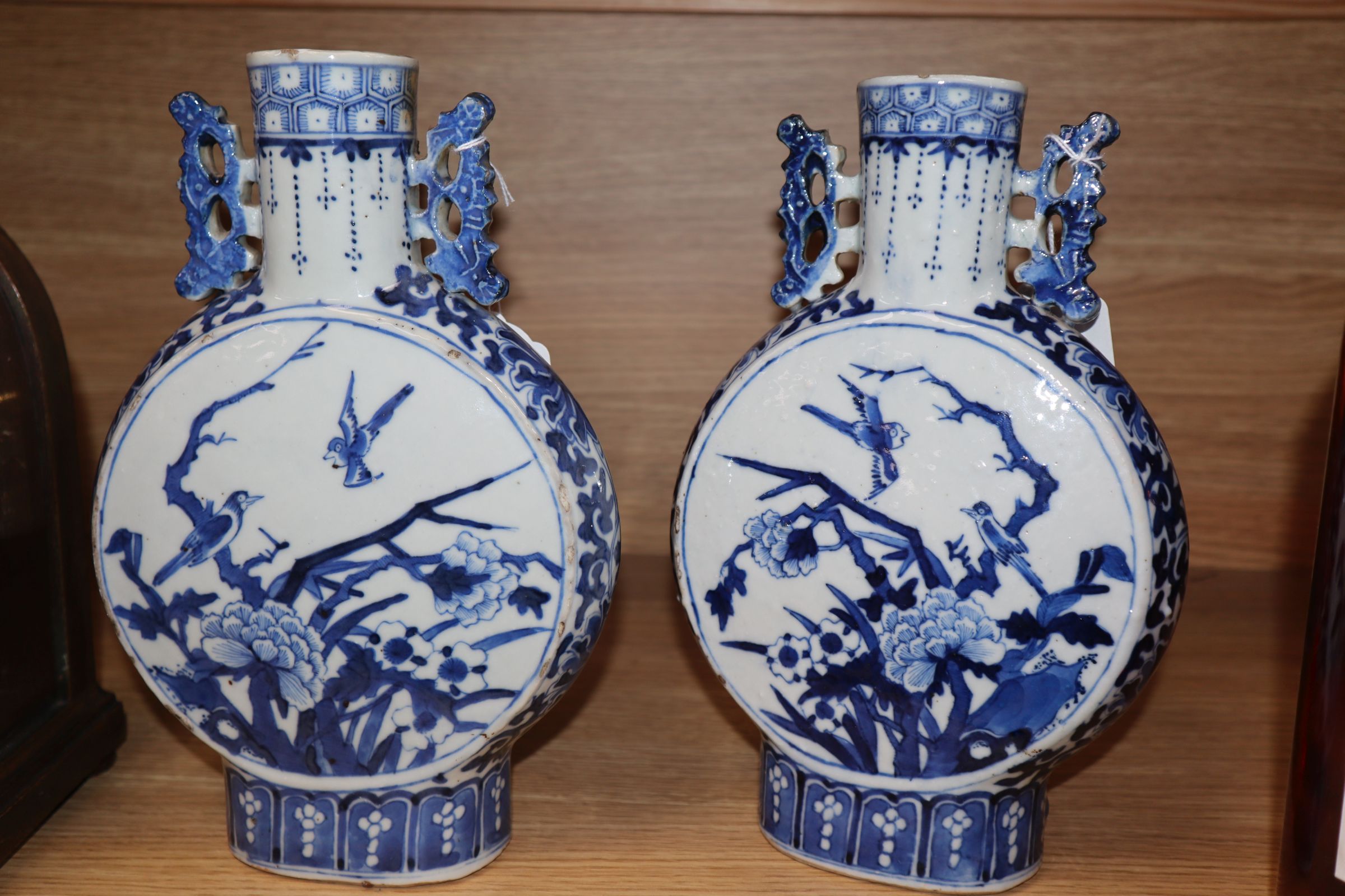 A pair of 19th century Chinese blue and white moon flasks, Kangxi marks, decorated birds and - Image 6 of 11