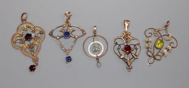 Five assorted early 20th century 9ct gold or yellow metal gem set pendants.