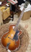 A Hofner president archtop acoustic guitar, numbered 2144, with mother of pearl inlay to the head