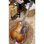 A Hofner president archtop acoustic guitar, numbered 2144, with mother of pearl inlay to the head