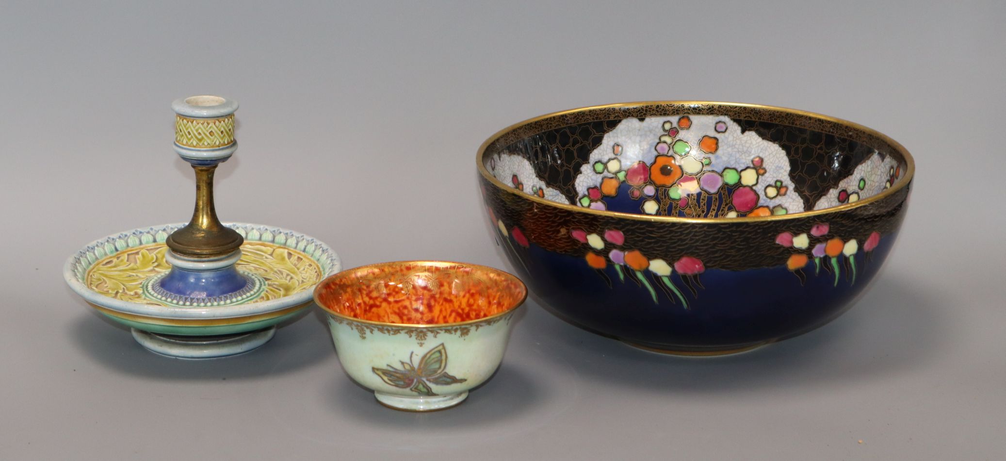 A Doulton Lambeth chamberstick, a Wedgwood butterfly lustre bowl and a Crown Devon bowl