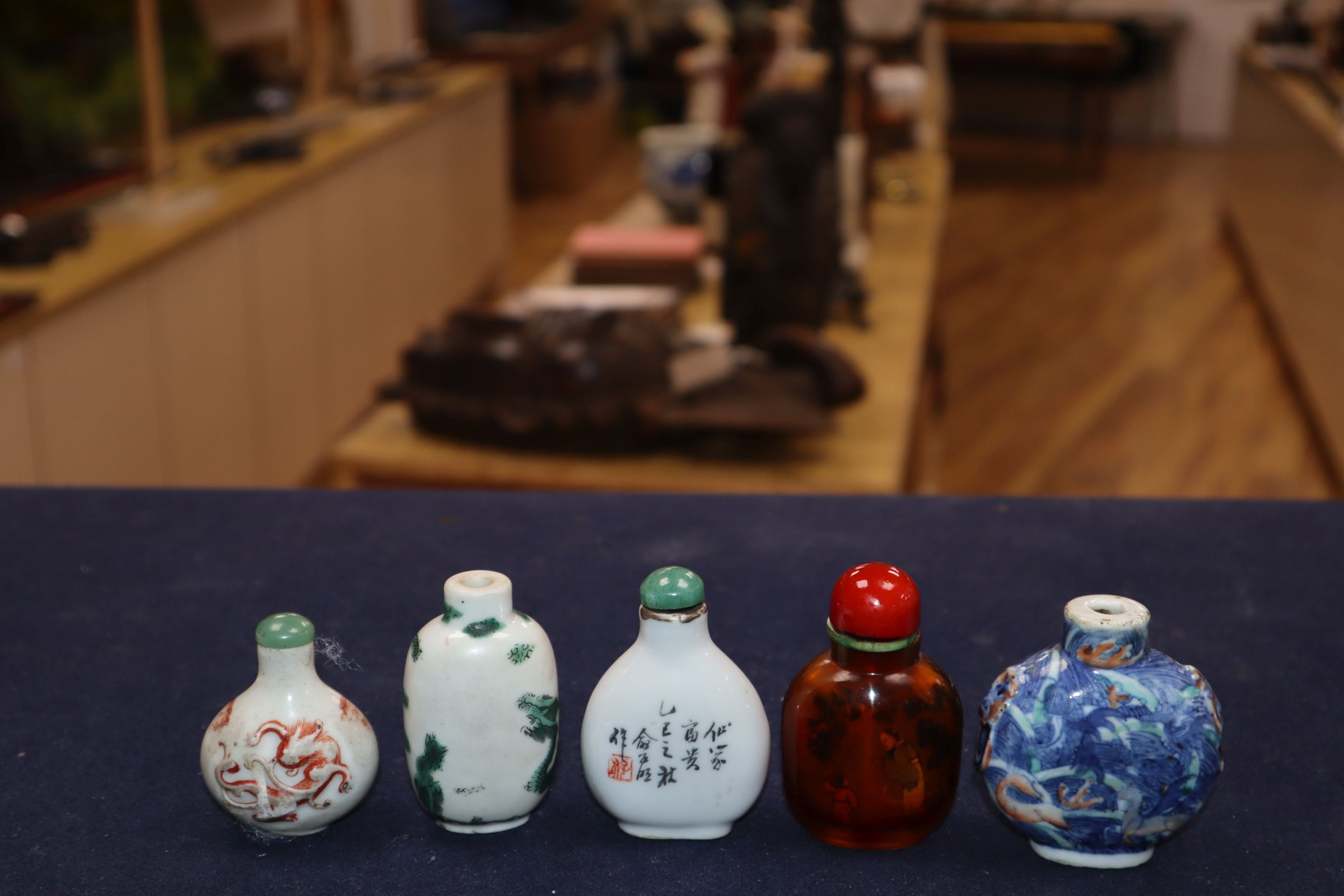 Four 19th century porcelain snuff bottles and an inside painted amber glass snuff bottle - Image 4 of 8