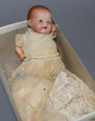 A small Armand Marseille baby doll with open mouth