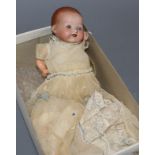 A small Armand Marseille baby doll with open mouth