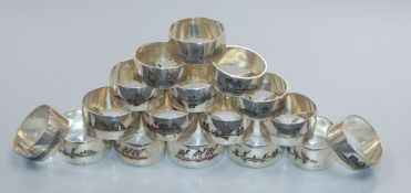 A set of seventeen white metal and niello serviette rings, gross 340 grams.