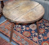 A 17th oak and elm cricket table, lacking spindle stretchers Diameter 74cm