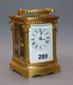 A late 19th century French gilt brass eight day repeating carriage clock, with bow front case height