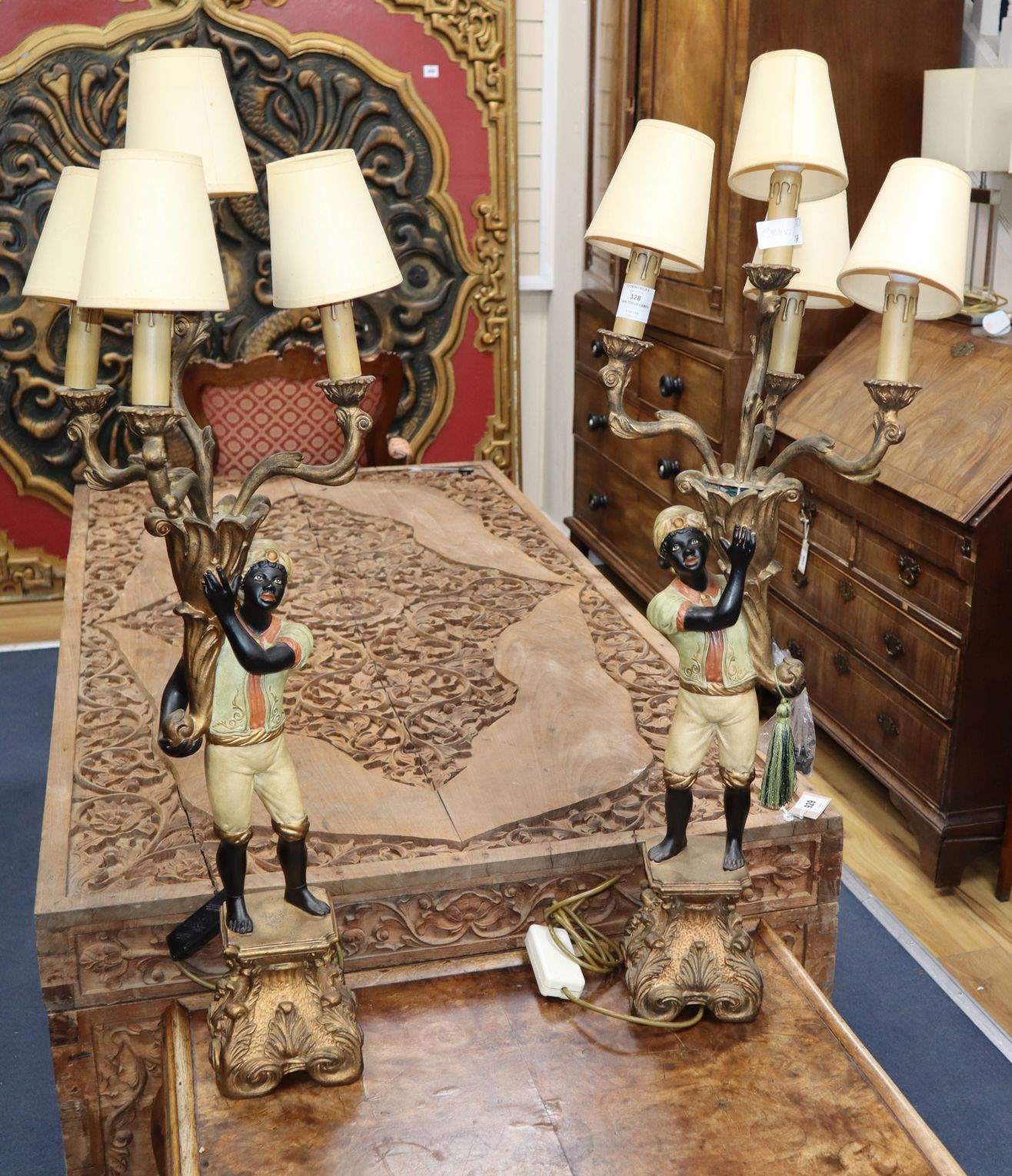 A pair of wood and composition Blackamoor table lamps