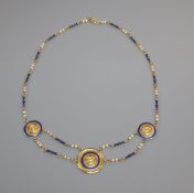 A 750 yellow metal, seed pearl and blue enamel set triple disc necklace, 52cm, gross 23.4 grams.