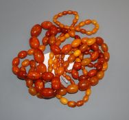 Two single strand graduated amber bead necklaces, gross weight 104 grams, shortest, 86cm, longest