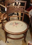 An Edwardian tapestry seat elbow chair