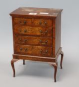 A miniature walnut chest on stand height 29cm