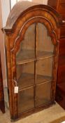 A 1920's Queen Anne revival walnut hanging corner cabinet W.60cm