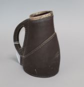 A Victorian silver mounted Lambeth 'faux leather' jug, won by E.W. Backman 1894