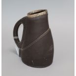 A Victorian silver mounted Lambeth 'faux leather' jug, won by E.W. Backman 1894