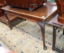 A George II style walnut centre table on carved cabriole legs and pad feet L.150cm