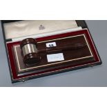 A Garrard silver mounted ceremonial gavel and stand, case stand width 28cm