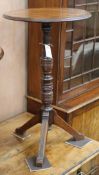 An Arts and Crafts walnut tripod table W.45cm