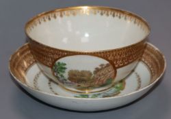 An 18th century Chinese tea bowl and saucer, with English decoration