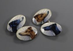 A pair of sterling and enamel oval cufflinks, decorated with the heads of greyhounds.