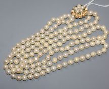 A cultured pearl double row necklace with gold, cultured pearl and emerald clasp, stamped 14k