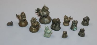 A group of 19th century bronze opium weights