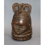 An African carved wood helmet mask height 28cm