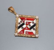 A late Victorian yellow metal, split pearl and enamel pendant, decorated with armorial?, 40mm.
