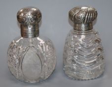 Two late Victorian silver mounted cut glass scent bottles, one with swirl glass decoration, John