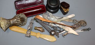 A white metal propelling pencil and assorted writing accessories