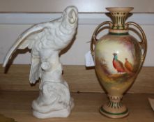 A Worcester style vase and a pottery parakeet