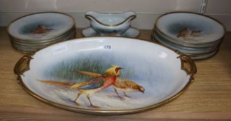 A French porcelain fourteen piece dinner service painted with game birds, signed Barid