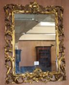 A carved giltwood wall mirror W.57cm