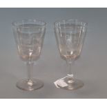 A pair of wheel engraved glass goblets height 20cm