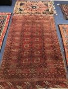 A Bokhara rug and smaller Caucasian design rug Larger 195 x 125cm