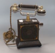 An early 20th century telephone height 33cm