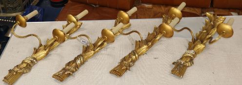 A set of four gilt plaster two branch wall sconces