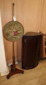 A mahogany bowfront hanging corner cabinet and a Regency polescreen W.57cm and 36cm